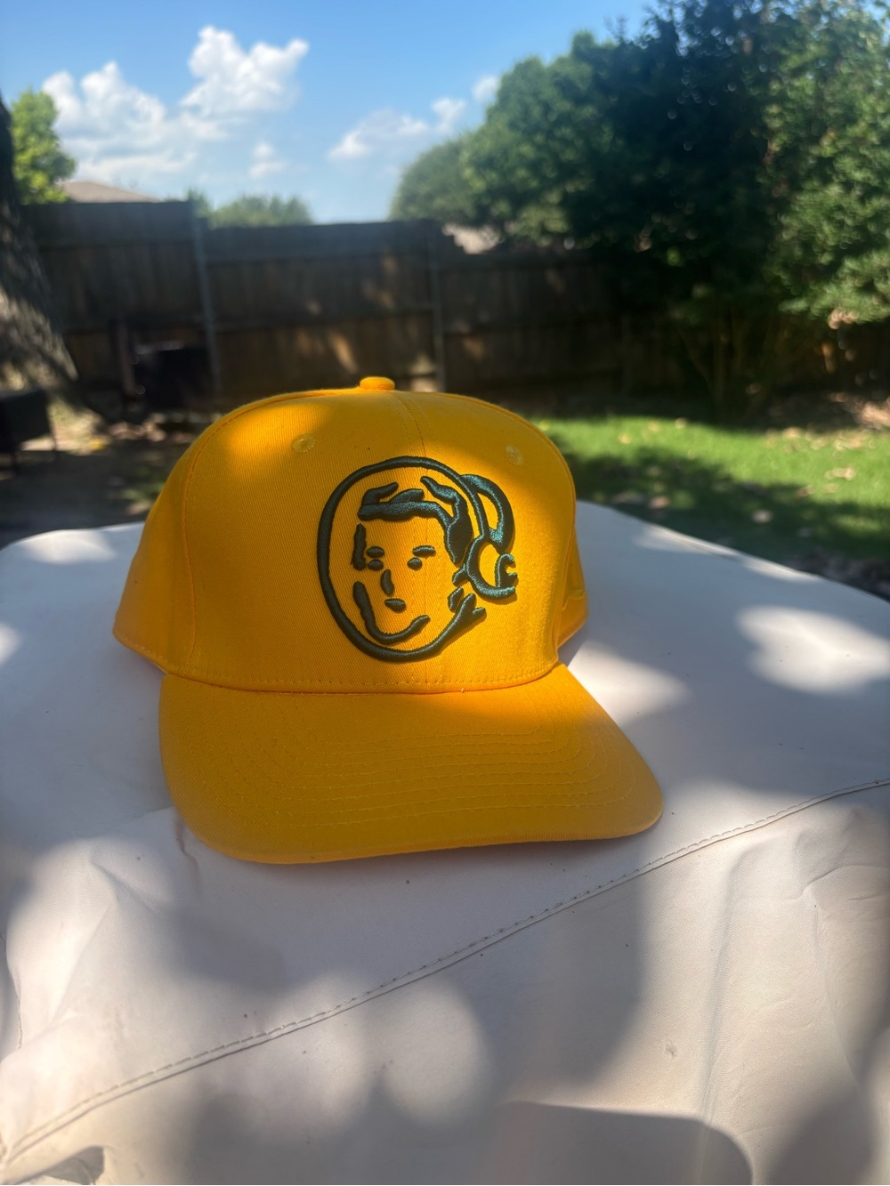 Yellow Trucker Hat with Embroidered Face Logo